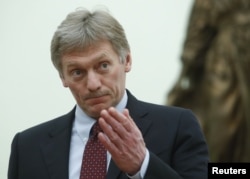 FILE - Kremlin spokesman Dmitry Peskov attends a meeting of Russian President Vladimir Putin at the Kremlin in Moscow, March 26, 2018.