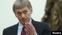 FILE - Kremlin spokesman Dmitry Peskov attends a meeting with Russian President Vladimir Putin at the Kremlin in Moscow, March 26, 2018. 