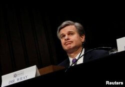 Federal Bureau of Investigation (FBI) Director Christopher Wray testifies before a Senate Intelligence Committee hearing on Capitol Hill in Washington, Feb. 13, 2018.