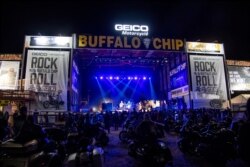 Motorcycles are parked in the audience during The Reverend Horton Heat's performance on the Wolfman Jack Stage at Buffalo Chip during the 80th annual Sturgis Motorcycle Rally on Aug. 15, 2020, in Sturgis, S.D.