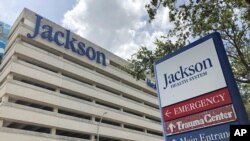 FILE - An entrance at Jackson Memorial Hospital is shown, July 9, 2020, in Miami. Florida. 