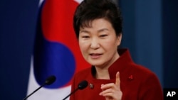 South Korean President Park Geun-hye answers to a reporter's question during her news conference at the Presidential Blue House in Seoul, South Korea, Wednesday, Jan. 13, 2016.