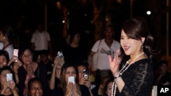 FILE - Thai Princess Ubolratana Mahidol waves outside the Grand Palace in Bangkok, Thailand, Oct. 27, 2017. 