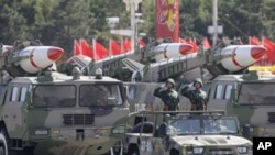 Missiles are displayed in a parade to celebrate the 60th anniversary of China's founding, Beijing, Oct. 1, 2009.