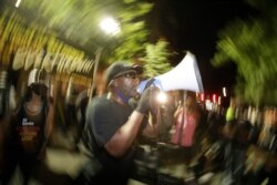 A speaker addresses the crowd during a Black Lives Matter protest at the Mark O. Hatfield United States Courthouse July 30, 2020, in Portland, Ore.