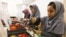 Members of Afghan robotics girls team which was denied entry into the United States for a competition, work on their robots in Herat province, Afghanistan July 4, 2017. 