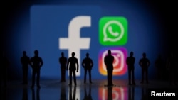 Facebook, Whatsapp and Instagram logos are displayed in this illustration taken October 4, 2021. 