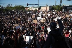 Demonstrators gather to protest the killing of George Floyd on May 30, 2020 in Minneapolis, Minnesota.