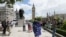 A demonstrator wrapped in the EU flag takes part in a protest opposing Britain's exit from the European Union in Parliament Square following yesterday's EU referendum result, London, Saturday, June 25, 2016.