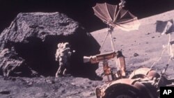 Scientist-Astronaut Harrison H. Schmitt is photographed working beside a huge boulder at Station 6 during the third Apollo 17 extravehicular activity at the Taurus-Littrow lunar landing site, Dec. 13, 1972. (AP Photo/NASA)