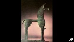 This undated photo provided by the Greek Culture Ministry on Wednesday, June 10, 2020, shows an 8th Century B.C. figurine of a horse from the so-called Geometric period of ancient Greek art that was listed for auction by Sotheby's in New York in May 2018.