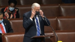 In this image from video, Rep. Steny Hoyer, D-Md., takes his face covering off as he speaks on the floor of the House of Representatives at the U.S. Capitol in Washington, April 23, 2020.