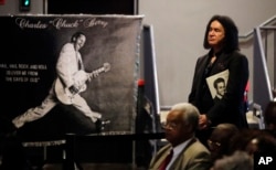 Gene Simmons, co-founder of the rock band Kiss, watches from the back of the room during a celebration of life for rock 'n' roll legend Chuck Berry, April 9, 2017, in St. Louis.