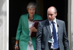 Britain's Prime Minister Theresa May leaves 10 Downing Street for her weekly Prime Minister's Questions at the House of Commons in London, July 10, 2019.
