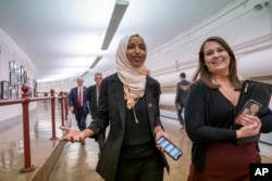 Rep. Ilhan Omar, D-Minn., walks to the chamber, March 7, 2019, on Capitol Hill in Washington.