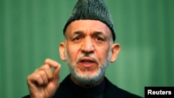 Afghan President Hamid Karzai speaks during a news conference in Kabul, Jan. 25, 2014. 