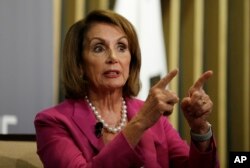 FILE - House Minority Leader Nancy Pelosi gestures while speaking at the Public Policy Institute of California, Aug. 22, 2018, in San Francisco.