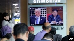 A TV screen shows images of U.S. President Donald Trump, left, and North Korean leader Kim Jong Un during a news program at the Seoul Railway Station in Seoul, South Korea, May 2, 2017.
