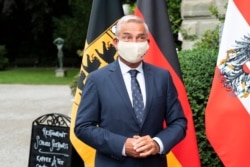 FILE - Thomas Strobl, Minister of the Interior, Digitalisation and Migration, arrives to a meeting in Kreuzlingen, Switzerland, June 17, 2020.