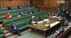 In this screengrab provided by the House of Commons, Britain's Prime Minister Boris Johnson speaks during the debate in the House of Commons on the EU (Future Relationship) Bill in London, Dec. 30, 2020.