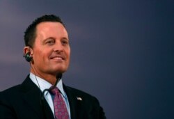 FILE - Ambassador Richard Grenell listens to Serbian President Aleksandar Vucic during a press conference after their meeting, in Belgrade, Serbia, Jan. 24, 2020.