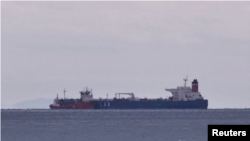 The seized oil tanker Lana, previous name Pegas, is seen anchored off the shore of Karystos, on the Island of Evia, Greece, April 19, 2022. (Vassilis Triandafyllou/Reuters)