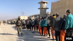 Surrendered ISIS members are taken under SDF control in Hasakah prison