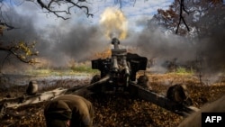 Ukrainian artillerymen fire a 152 mm towed gun-howitzer (D20) at a position on the front line near the town of Bakhmut, in eastern Ukraine's Donetsk region, on October 31, 2022. Since Russia invaded Ukraine, Bakhmut has been one of the most lethal battlefields for both sides.