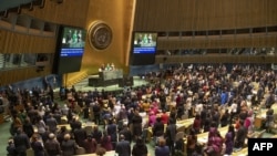 FILE - This United Nations handout photo shows participants at the opening of the 63rd session of the Commission on the Status of Women (CSW), March 11, 2019, at U.N. headquarters in New York.