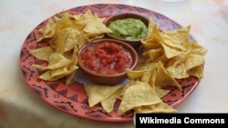 Researchers say Super Bowl parties, which often feature chips and dip, help spread the flu.