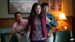 This image released by A24 Films shows, from left, Stephanie Hsu, Michelle Yeoh and Ke Huy Quan in a scene from, "Everything Everywhere All At Once."