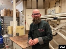 Denis Durand is seen at his bakery in Paris, which has been in the family for six decades. (Lisa Bryant/VOA)