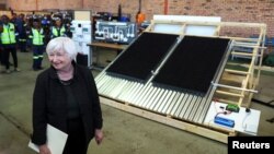 U.S. Treasury Secretary Janet Yellen stands next to a solar panel station, during a visit to the coal mining region of Mpumalanga, South Africa, Jan. 27, 2023. 