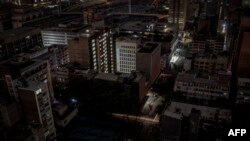 FILE - A general view of some parts of the Braamfontein area of Johannesburg, South Africa, submerged in darkness because of a load-shedding rolling blackout on Jan. 31, 2023. 