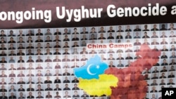 A sign is displayed as the East Turkistan Awakening Movement holds a rally outside the White House against the Chinese Communist Party to coincide with the 73rd National Day of the People's Republic of China in Washington, Oct. 1, 2022.