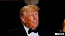 FILE - Former U.S. President Donald Trump hosts a New Year's Eve party at his Mar-a-Lago resort in Palm Beach, Florida, Dec. 31, 2022. 