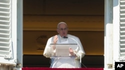 Pope Francis delivers his speech during the Angelus noon prayer from the window of his studio overlooking St. Peter's Square, at the Vatican, Feb. 12, 2023.