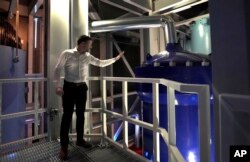 Last Energy CEO Bret Kugelmass explains how power could be produced from a nuclear microreactor during a tour inside the company's demonstration unit that contains a prototype reactor, Jan. 17, 2023, in Brookshire, Texas.