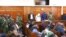 In dock from left to right, Peter Ngugi, Sylvia Wanjohi, Stephen Cheburet and Fredrick Leliman were sentenced in connection with the murders of three people, at Kenya's Milimani court, Feb. 3, 2023. 