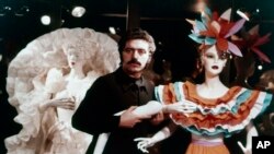 FILE - Waxwork mannequins were used by Paris couturier Paco Rabanne for the presentation of his 1973 collection of paper dresses, Jan. 22, 1973.