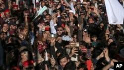 Supporters of Awami National Party take part in a rally denouncing militant attacks and demanding peace in the country, in Peshawar, Pakistan, Feb. 4, 2023. 