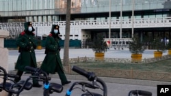 FILE - Chinese paramilitary policemen march in Beijing, Jan. 8, 2021. Human rights lawyer Li Yuhan was sentenced to 6-1/2 years in prison on Oct. 25, 2023.