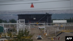 FILE - A general view shows an Enbridge oil sands processing facility near Fort McKay, Alberta, on Sept. 7, 2022.