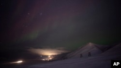 An aurora is pictured during a long exposure in Longyearbyen, Norway, Jan. 11, 2023.