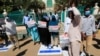 FILE - Sudanese demonstrators chant slogans as they step on Israeli flags during a rally against their country's signing of a deal normalizing relations with the Jewish state, in Sudan's capital Khartoum, Jan. 17, 2021.