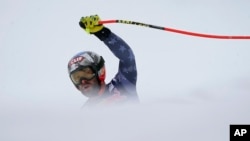FILE - The United States' Travis Ganong celebrates as he arrives at the finish area during an alpine ski, men's World Cup downhill race in Kitzbuehel, Austria, Jan. 21, 2023.