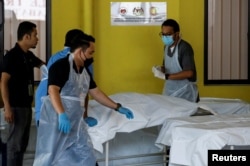 Dead body of a Batang Kali landslide victim is seen at Kuala Lumpur Hospital's mortuary in Kuala Lumpur, Malaysia, Dec. 16, 2022.