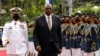 Menteri Pertahanan A.S. Lloyd Austin (kedua dari kiri) berjalan melewati pasukan kehormatan setibanya di Departemen Pertahanan Nasional di kamp militer Camp Aguinaldo, Quezon City, Metro Manila, Filipina, Kamis 2 Februari 2023. (Rolex Dela Pena/Pool Photo via AP)