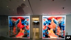 Visitors view artist Refik Anadol's "Unsupervised" exhibit at the Museum of Modern Art, Jan. 11, 2023, in New York. 