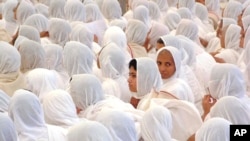 FILE - Hundreds of Jain nuns take part in the inauguration prayers of the 27 day long religious celebration of the Smrutimandir Temple in Ahmadabad, India Thursday Jan 31, 2002. 